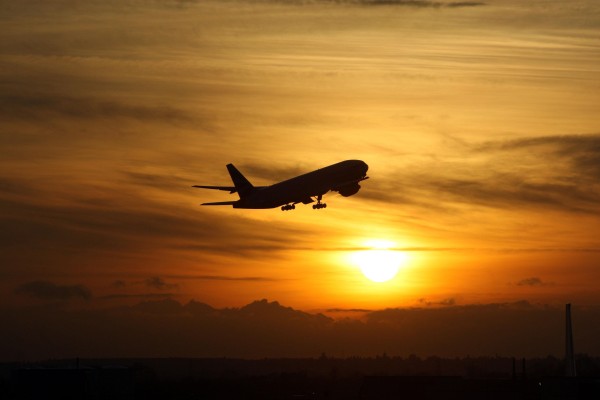 passenger-plane-takeoff-at-sunset-photo-background